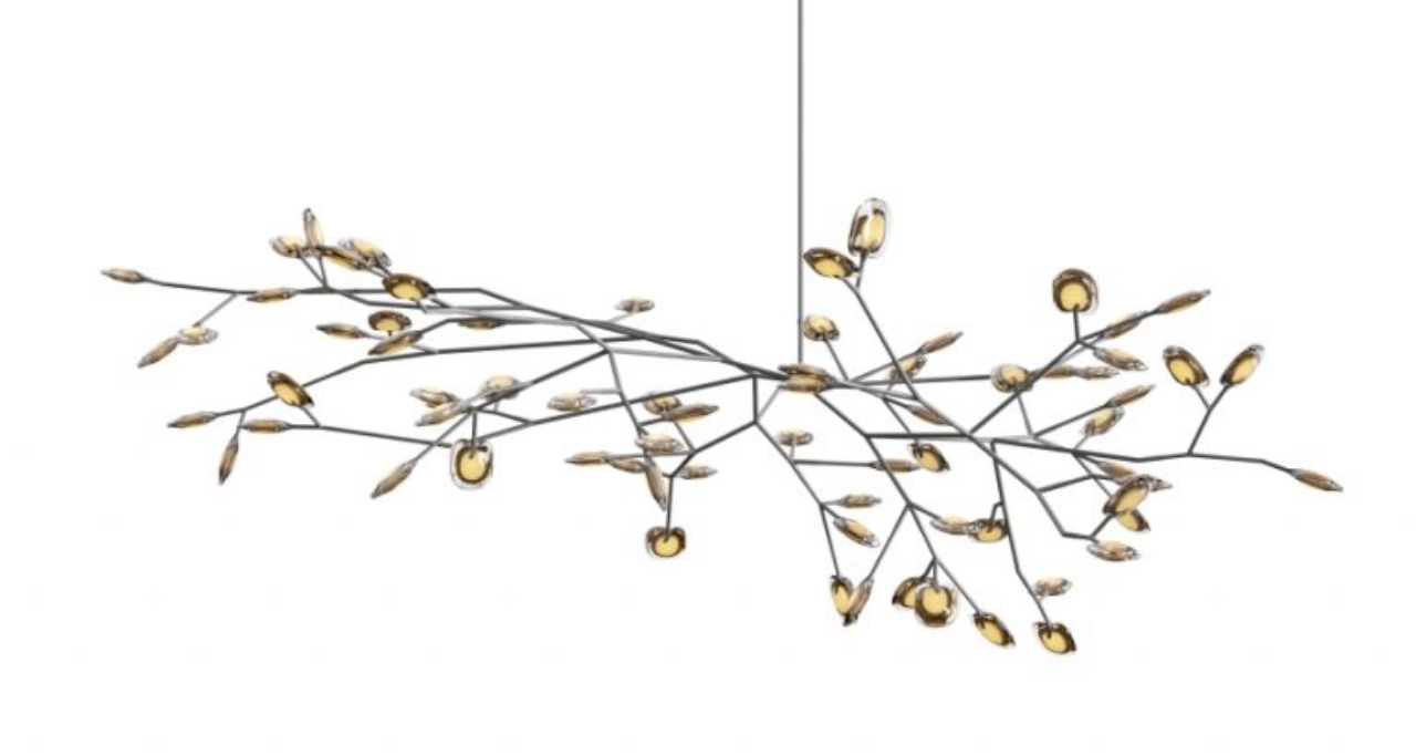 Luminária 16.72 da canadense Bocci que utiliza 72 pendentes em uma estrutura de aço inox modular que imita galhos de árvores. 
