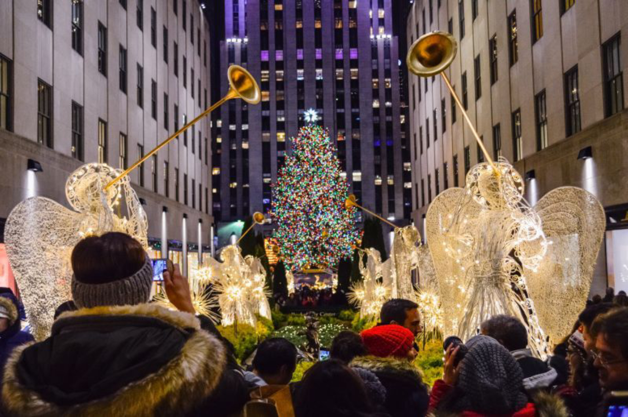 NEW YORK-DECEMBER 4: Crowds of tourists visit Rockefeller Center to see the tree and holiday decorations on December 4 2014 in Manhattan.