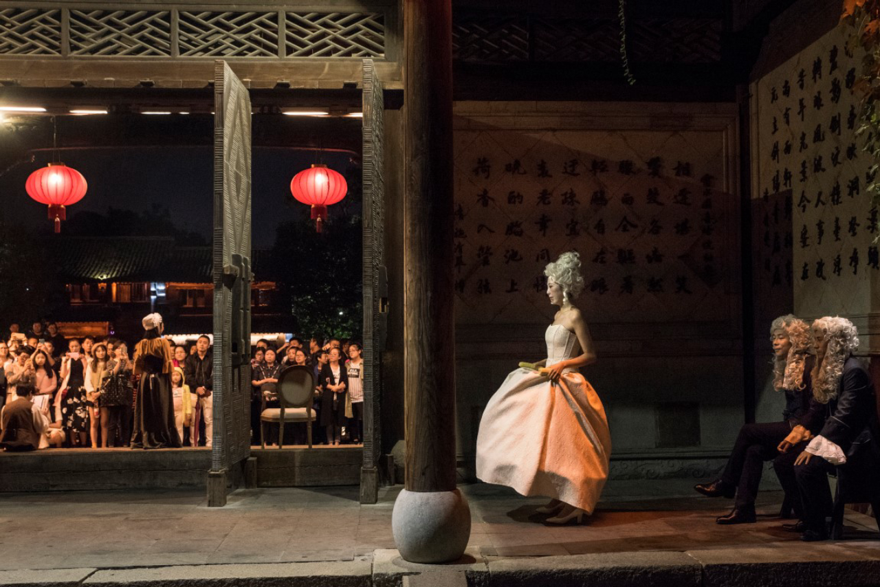 Actors during a performance in a renovated building in Wuzhen, China, Oct. 20, 2016. The performers were there for an annual theater festival that has helped Wuzhen muscle its way onto the international cultural map by drawing tens of thousands of visitors to a town that gets nearly 7 million tourists a year. (Gilles Sabrie/The New York Times)