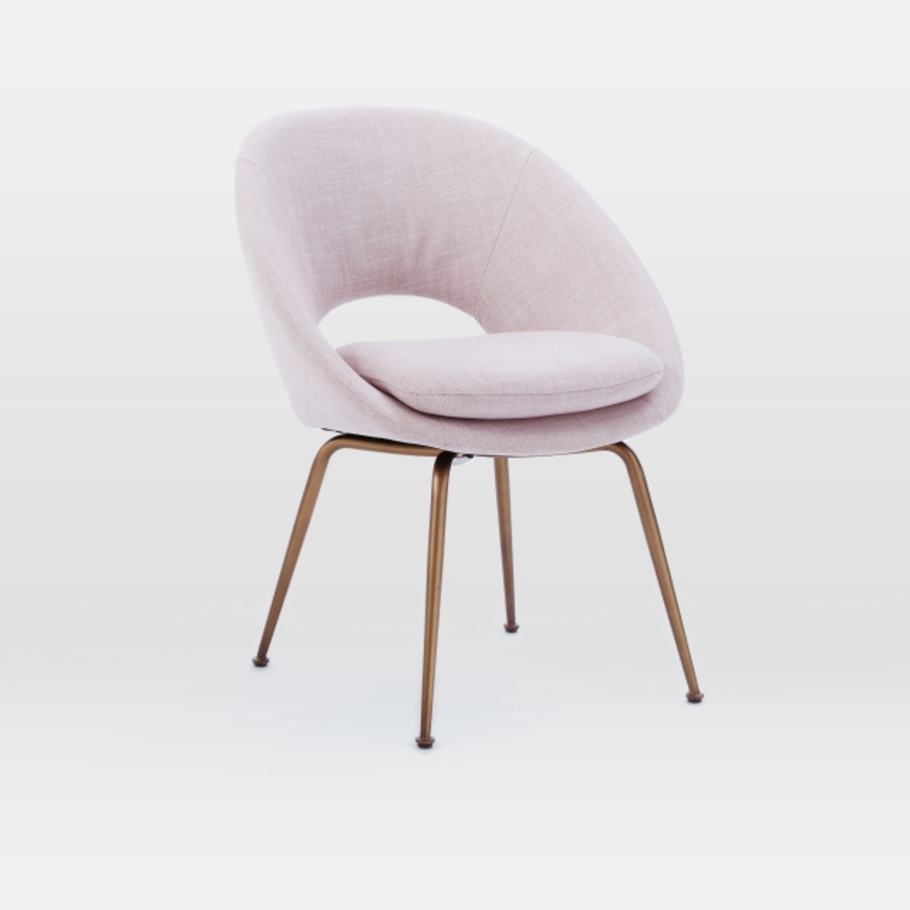 West Elm’s Orb upholstered dining chair comes in a Dusty Blush fabric ($249, westelm.com).<br>MUST CREDIT: West Elm