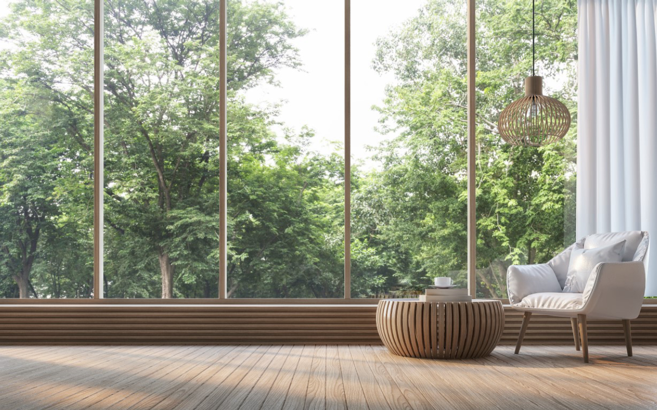 Modern living room with nature view 3d rendering Image. There are decorations in room with wood. There are large windows overlooking the surrounding nature and forest