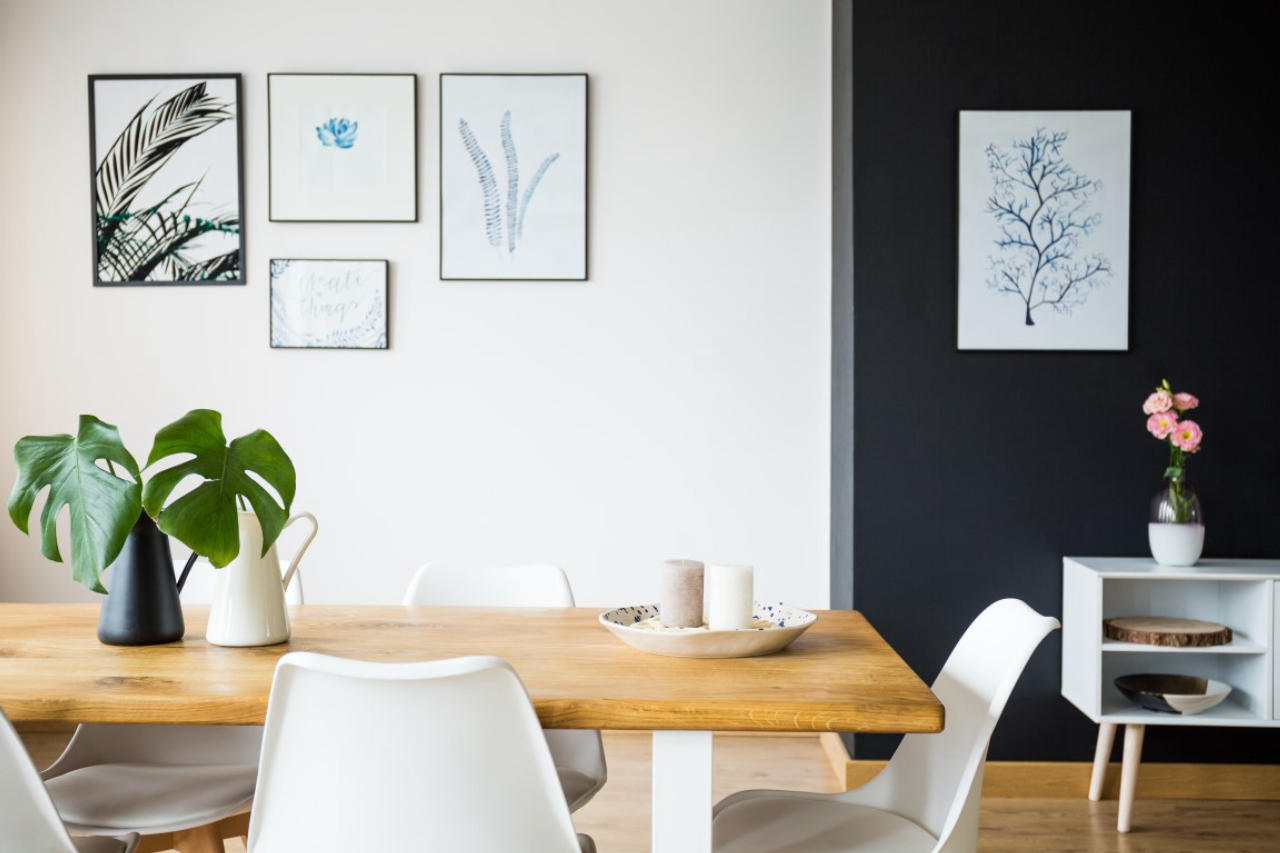 Modern dining room with plant decoration and pictures