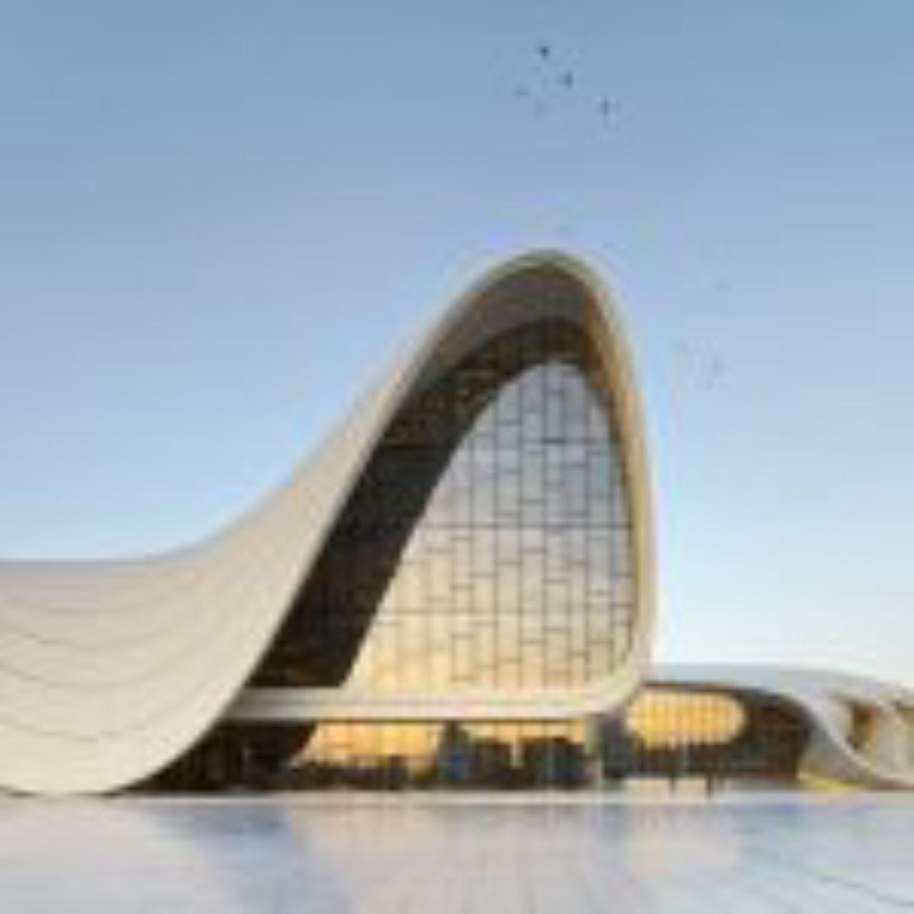 Centro cultural Heydar Aliyev, em Baku, no Azerbaijão, com fachada homogênea e cheia de movimento: a obra de 2013 é uma das mais representativas da arquiteta por fazer gritar a fluidez quase natural de seus edifícios.<p></p><p>Foto: Zaha Hadid Architects/Riba Comms/Divulgação</p>