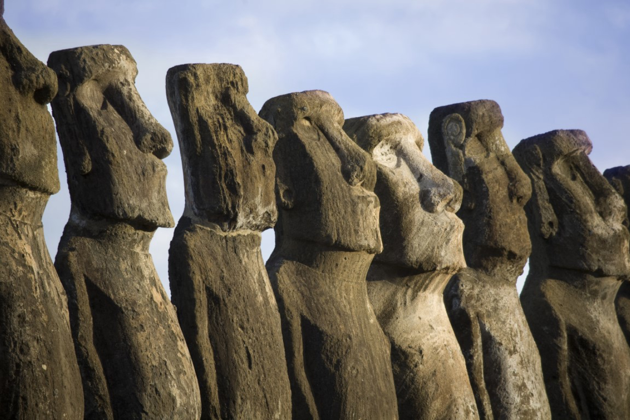 a row with mysterious statues at easter island