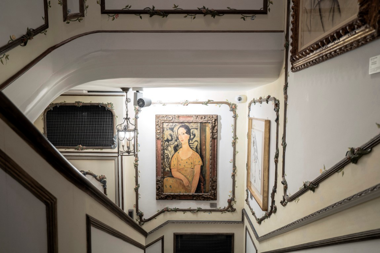 Amedeo Modigliani’s “Woman in the Yellow Dress” displayed on the staircase of Francesco Federico Cerruti's villa in Rivoli, Italy, May 1, 2019. Cerruti’s collection consists of about 1,000 items displayed in the quirky Provençal-style villa he built in the 1960s. (Alessandro Grassani/The New York Times)