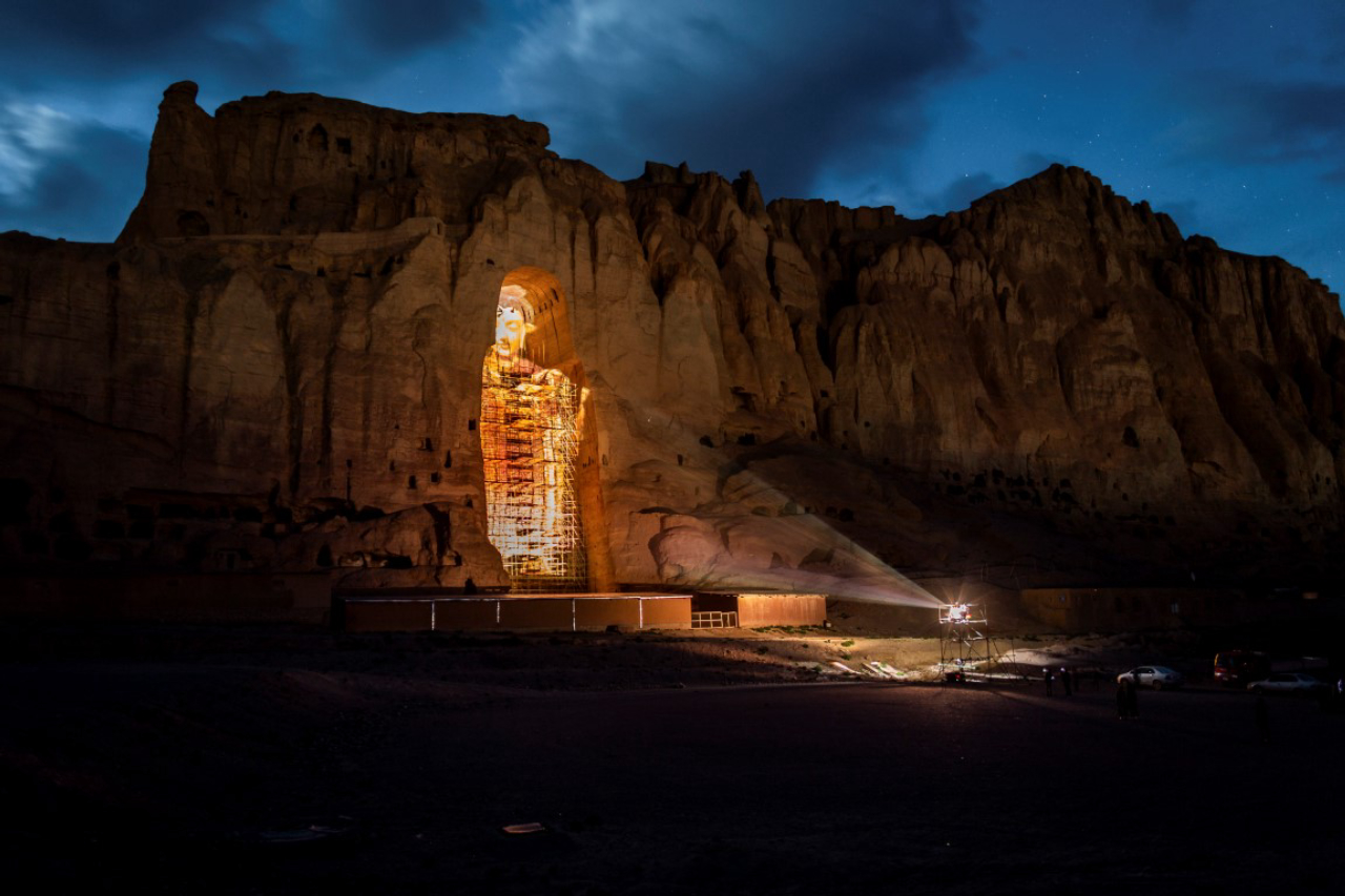 A 3-D projection of how a destroyed Buddha, known as Solsol to locals, might have looked in Bamiyan, Afghanistan, May 20, 2019. Since the Taliban destroyed the two giant statues in March 2001, the degradation has continued, as Afghanistan and the international community have spent 18 years debating what to do to protect or restore the site. (Jim Huylebroek/The New York Times)