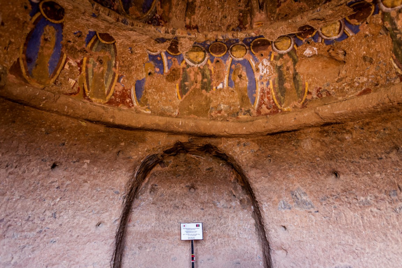 Damaged stucco and a sign announcing environmental monitoring in a domed cave in Bamiyan, Afghanistan, May 18, 2019. Since the Taliban destroyed the two giant statues in March 2001, the degradation has continued, as Afghanistan and the international community have spent 18 years debating what to do to protect or restore the site. (Jim Huylebroek/The New York Times)