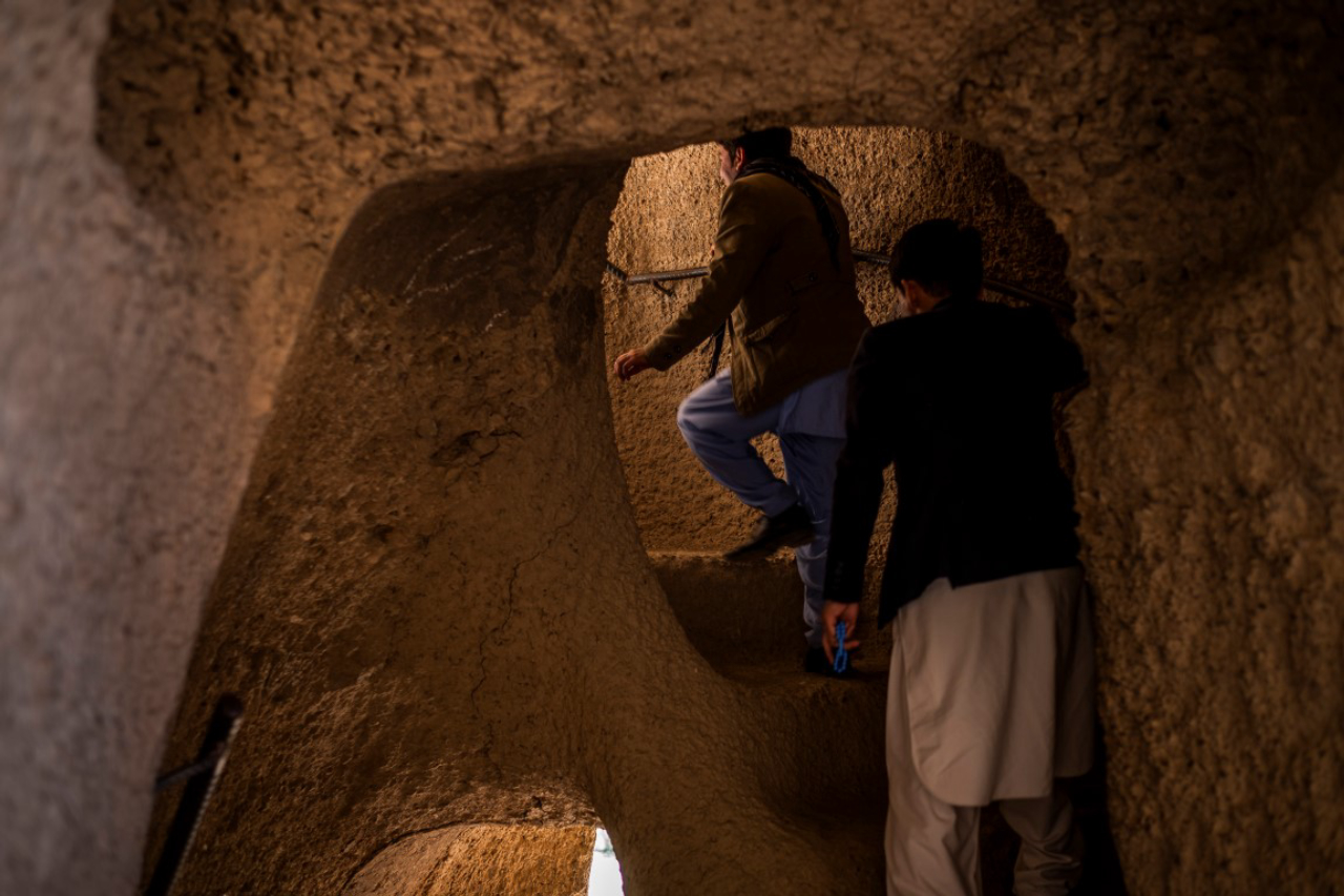 Tourists from Ghazni Province make their way through winding staircases carved from crumbly sandstone at the Buddha complex in Bamiyan, Afghanistan, May 18, 2019. Since the Taliban destroyed the two giant statues in March 2001, the degradation has continued, as Afghanistan and the international community have spent 18 years debating what to do to protect or restore the site. (Jim Huylebroek/The New York Times)