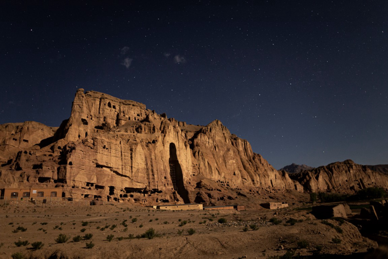 A full moon illuminates a Buddha niche in Bamiyan, Afghanistan, May 19, 2019. Since the Taliban destroyed the two giant statues in March 2001, the degradation has continued, as Afghanistan and the international community have spent 18 years debating what to do to protect or restore the site. (Jim Huylebroek/The New York Times)