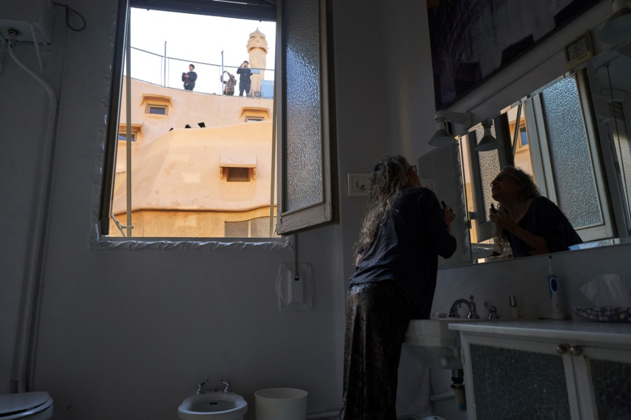 Ana Viladomiu washes her face in the bathroom of her apartment, inside the famous building of La Pedrera, designed by Catalan architect Antoni Gaudi, in Barcelona, Spain, Dec. 28, 2018. Living in Barcelona's most famous Gaudi home comes with its challenges. (Samuel Aranda/The New York Times)