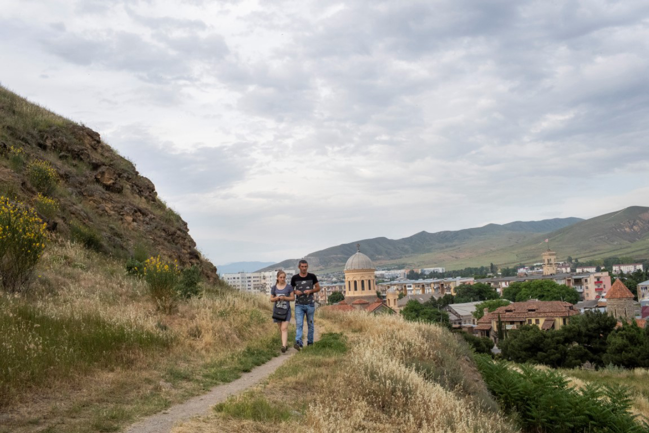 Tourists hike in Gori, Georgia, the home town of the Soviet dictator Joseph Stalin, May 6, 2019. The tone throughout the Joseph Stalin Museum here is admiring, a stirring narrative about a poor kid who, against long odds soared to the heights of power. Omitted are his millions of victims. (Daro Sulakauri/The New York Times)