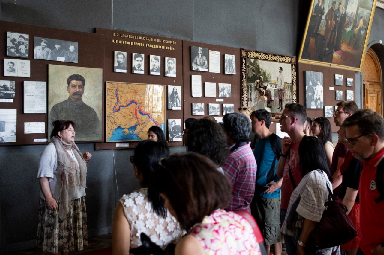 Tourists at the Joseph Stalin Museum, in the Soviet dictator's home town of Gori, Georgia, May 6, 2019. The tone throughout the museum is admiring, a stirring narrative about a poor kid who, against long odds soared to the heights of power. Omitted are his millions of victims. (Daro Sulakauri/The New York Times)