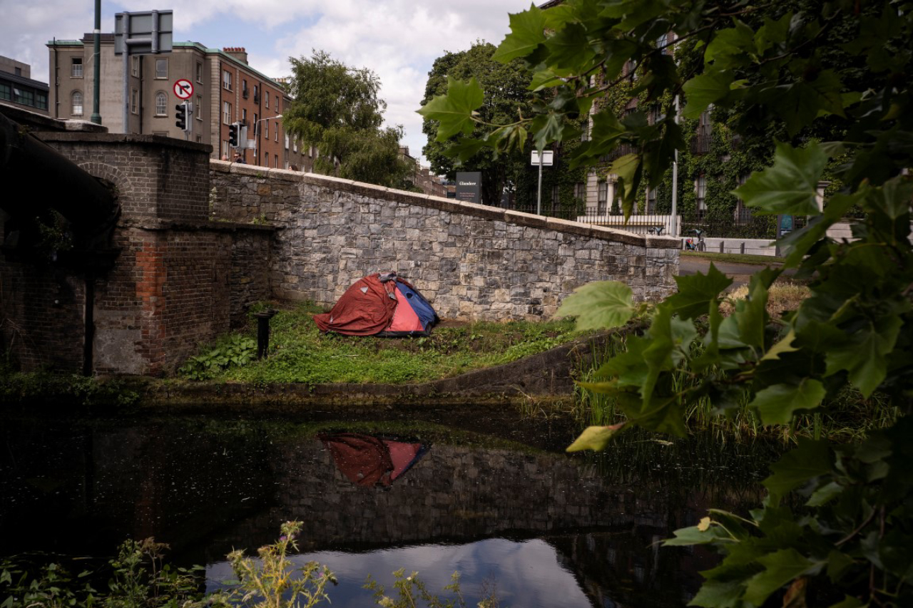 A tent used as a shelter by an homeless man beside the Grand Canal in central Dublin, Aug. 4, 2019. A housing shortage has made Dublin one of the world’s most expensive cities to rent in. Homelessness is up sharply, while homeownership has fallen. (Paulo Nunes dos Santos/The New York Times)