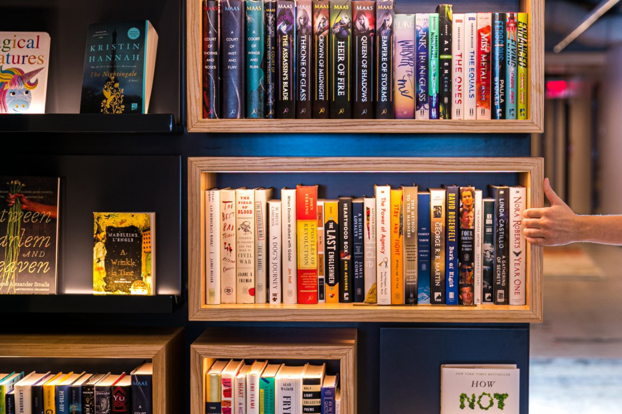 A wall with bookshelves pivots to reveal a secret green room at Macmillan Publishers in New York, Aug. 9, 2019. Secret rooms are popping up in workplaces. (Jeenah Moon/The New York Times)