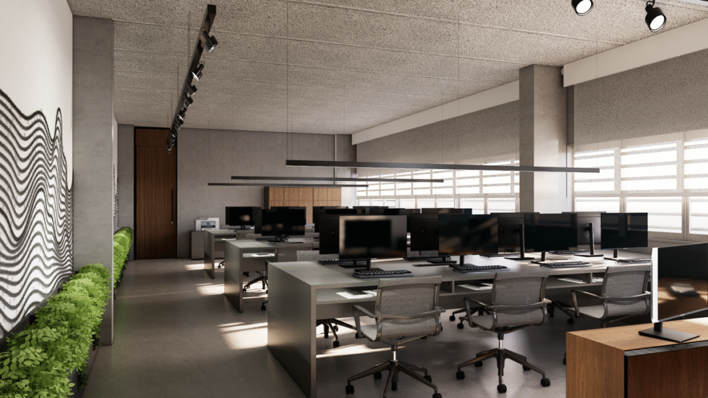 As estações de trabalho compartilhadas promovem a colaboração e a interação entre os times. Projeto: Camila Lobato Arquitetura + Alice Bigaton Arquitetura.