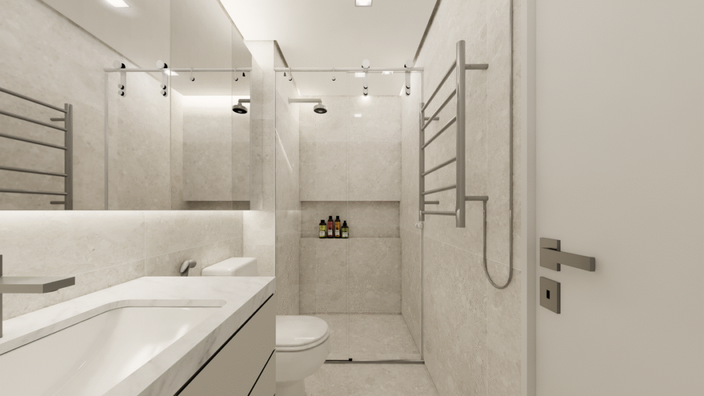 O toalheiro térmico e o nicho no box demonstram a atenção aos detalhes funcionais do projeto. Projeto: Studio Lucas Fasi.