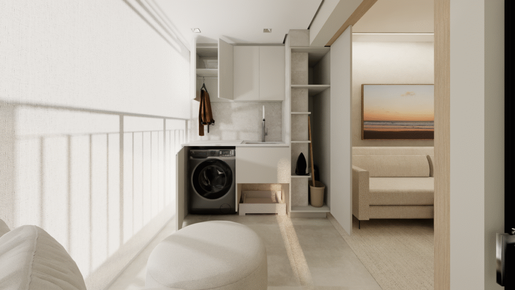 O armário planejado recuado esconde a lavanderia, garantindo que a varanda seja uma área de lazer funcional. Projeto: Studio Lucas Fasi.