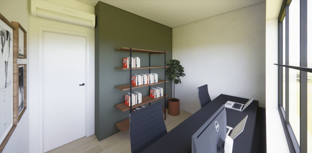 A bancada segue a linha da janela para garantir a vista e a luz natural. Os livros e documentos ficam organizados em uma estante lateral. Projeto: JJ Giovanella Arquitetura.