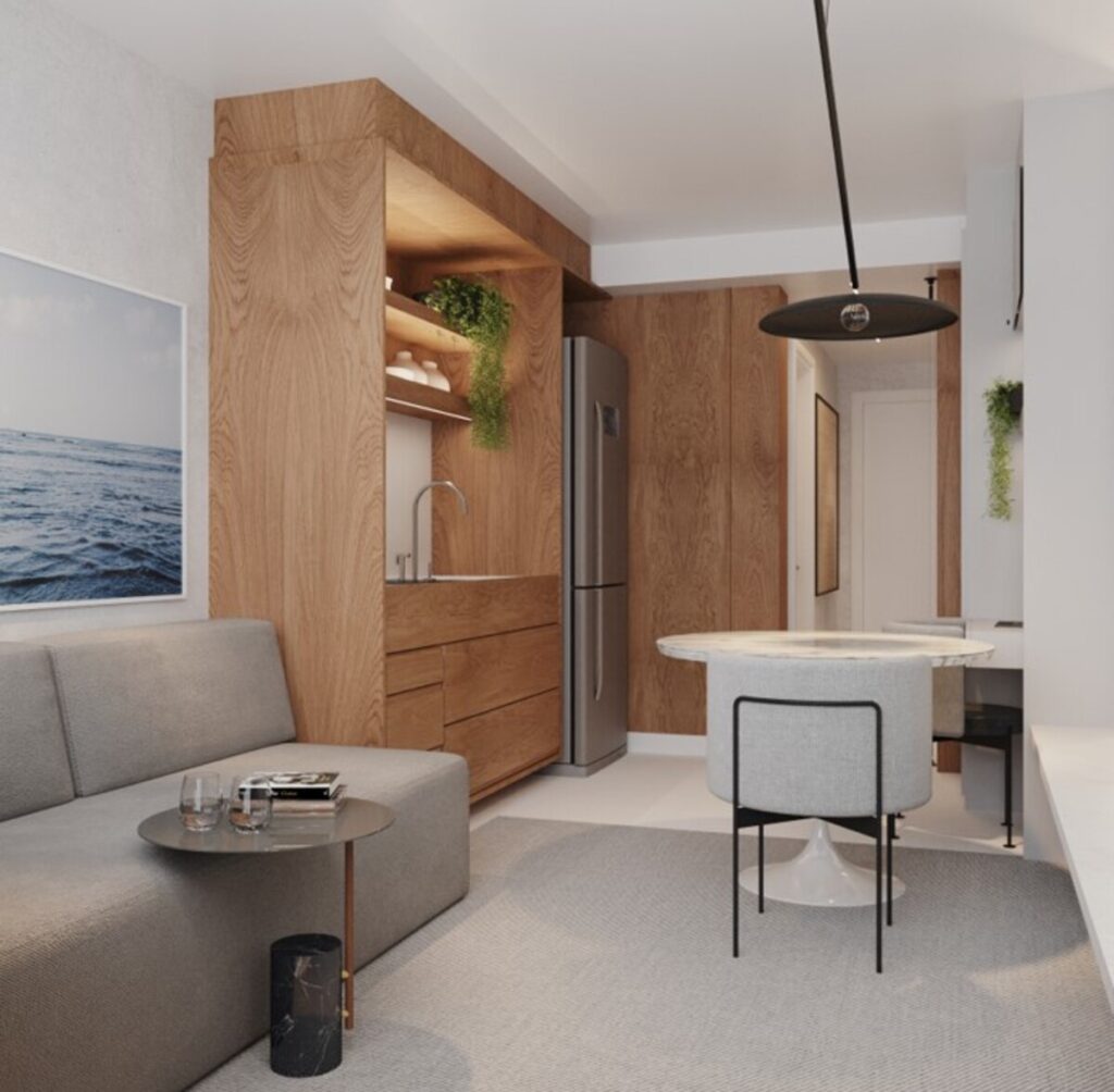 A marcenaria esconde a mini lavanderia e integra a cozinha de forma elegante. Projeto: Estúdio FJ