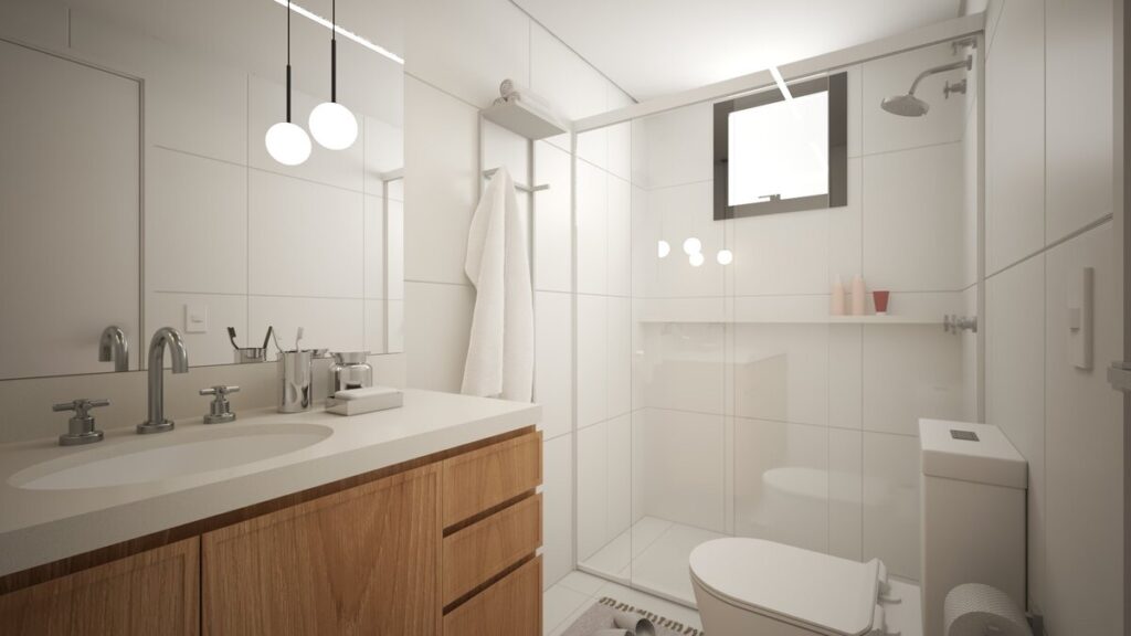 A escolha de cores claras e materiais naturais no banheiro garante sofisticação e leveza. Projeto: Isabela Cardoso Arquitetura.