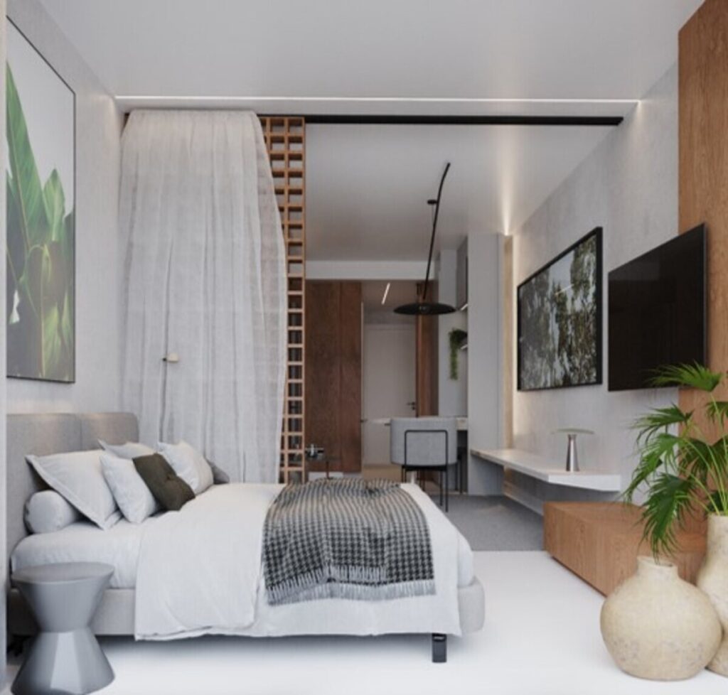 Um exemplo elegante de estúdio que utiliza divisórias leves para separar a área de dormir, mantendo a sensação de amplitude e luminosidade. Projeto: Estúdio FJ